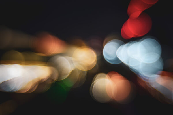 Photography zoom burst technique - abstract street lights after dusk