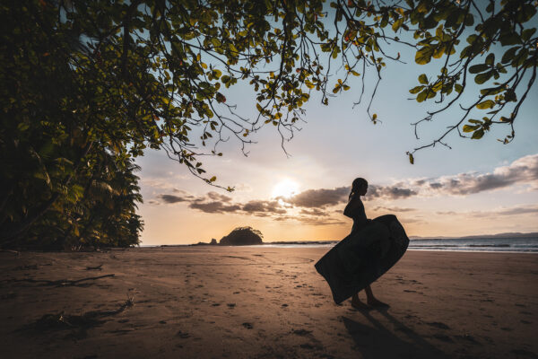 Silhouette photography - sunset girl on the beach ready hit the waves